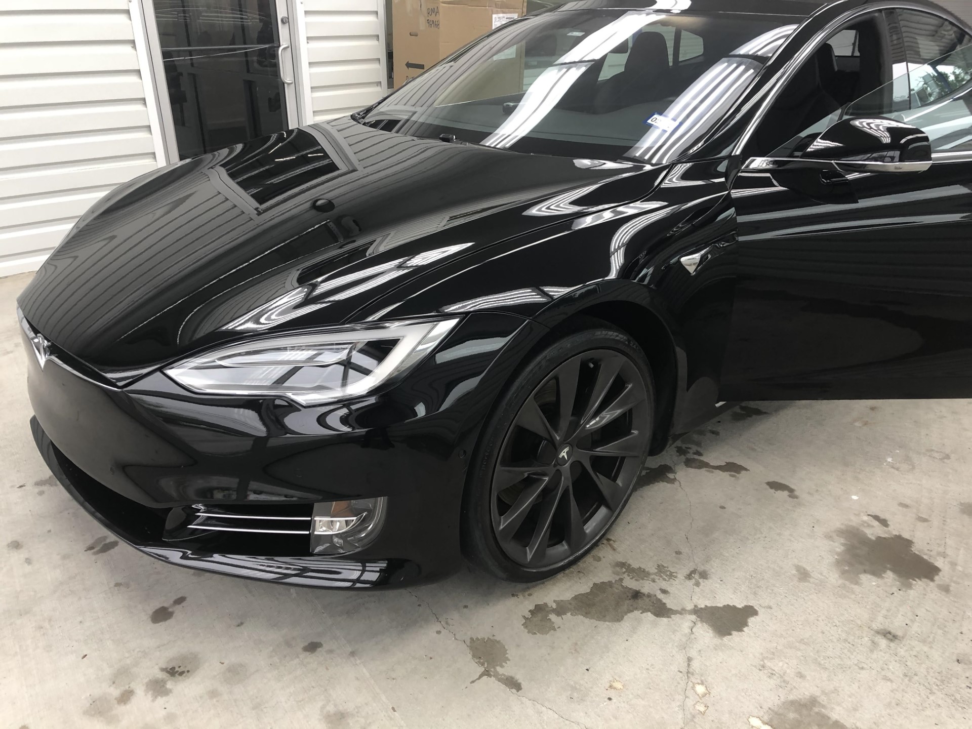 a black car in a garage  